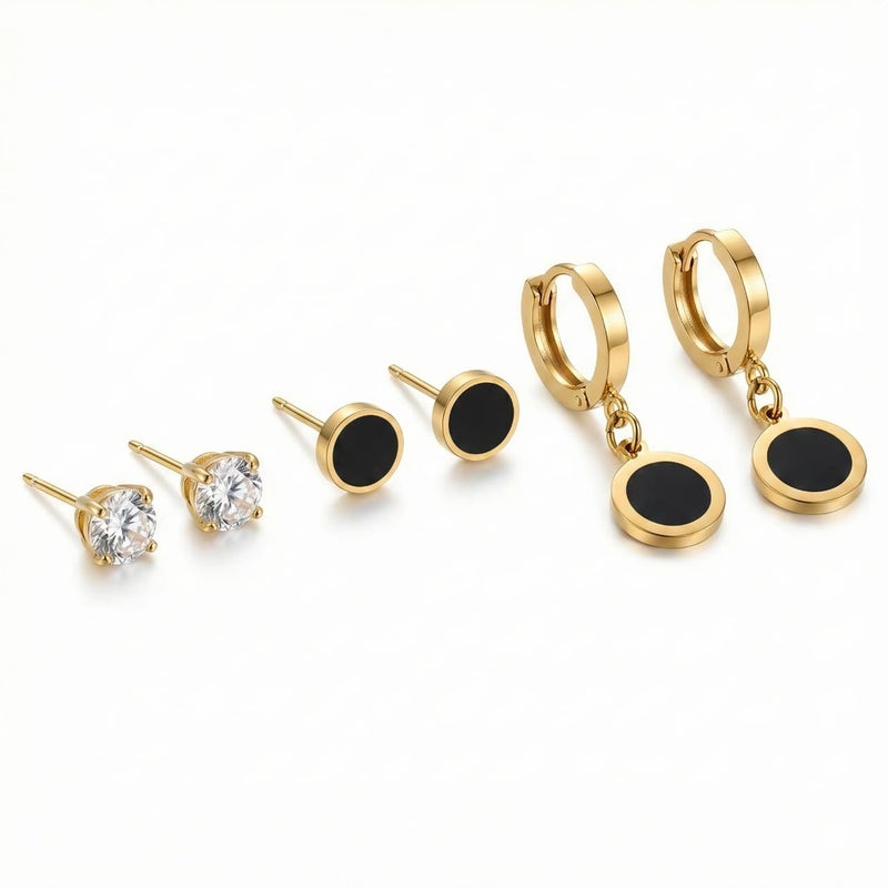 A set of three pairs of exquisite gold earrings: sparkling zircon studs, striking black posts, and luxurious black dangling circles. Crafted from durable stainless steel, a captivating and perfectly harmonious combination. - Image 1